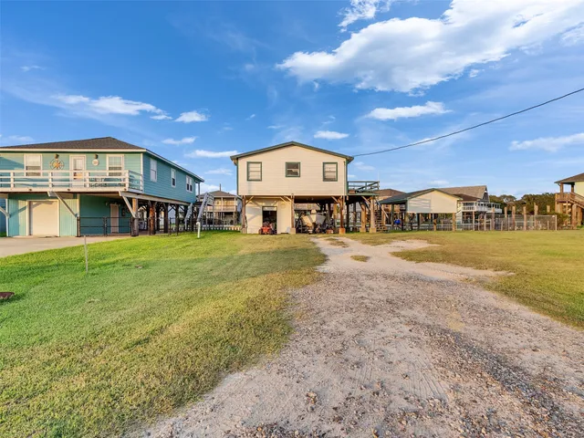 a view of a big yard with table and chairs