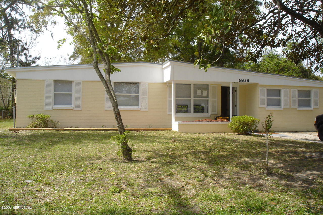 6836 Cavalier Road Jacksonville, FL 32208 - Photo 1 of 1 front view of a house with a yard