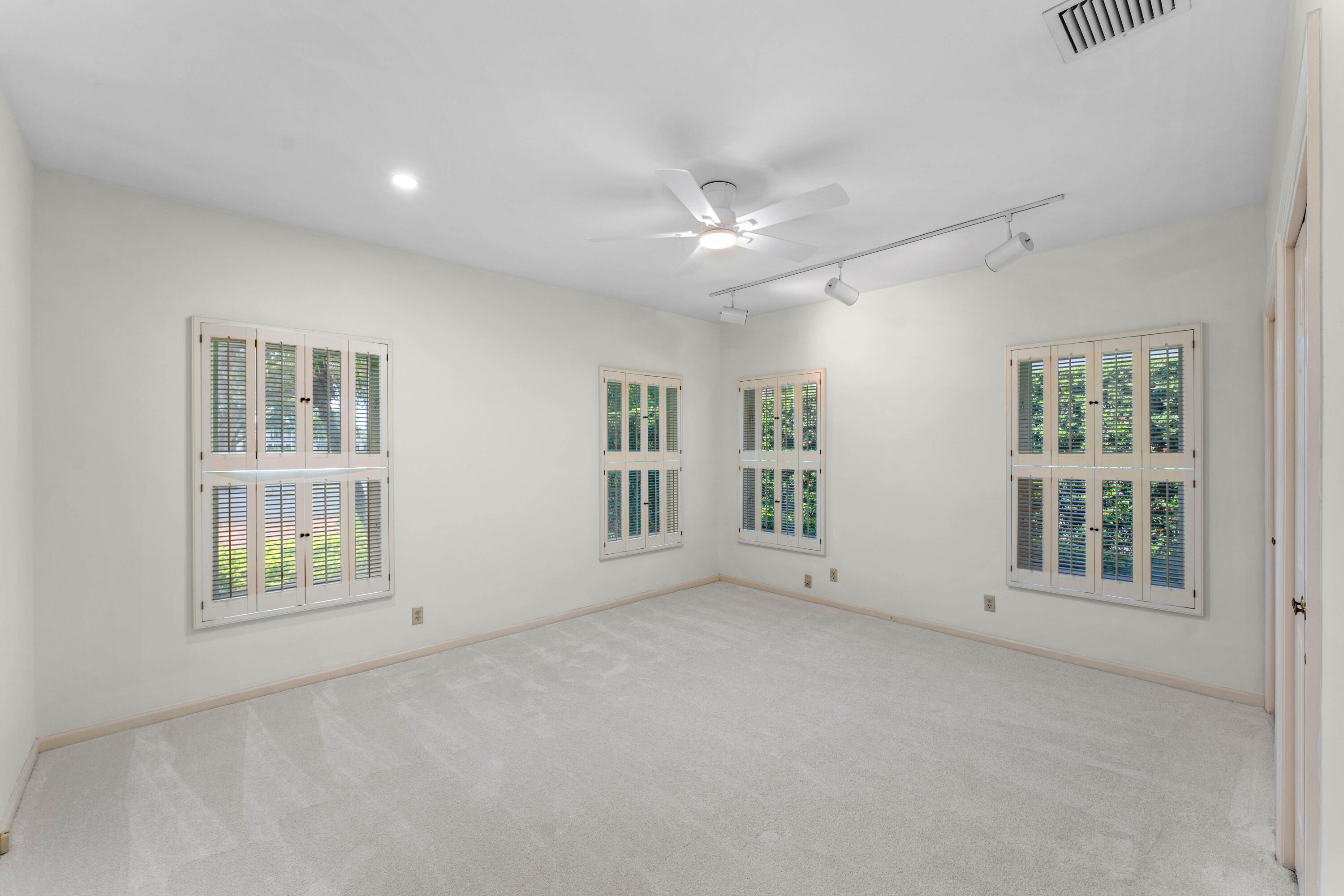 1851 Thatch Palm Drive Boca Raton, FL 33432 - Photo 31 of 70 an empty room with a empty space and windows
