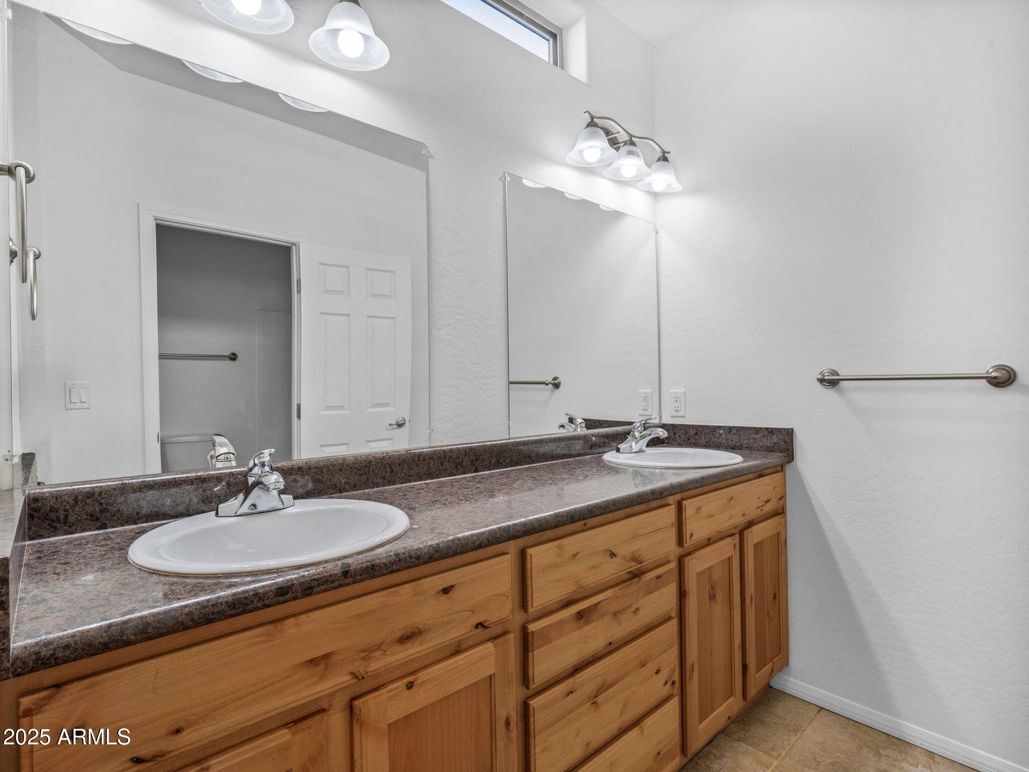 907 Quarter Horse Road Williams, AZ 86046 - Photo 18 of 26 a bathroom with a granite countertop sink and a mirror