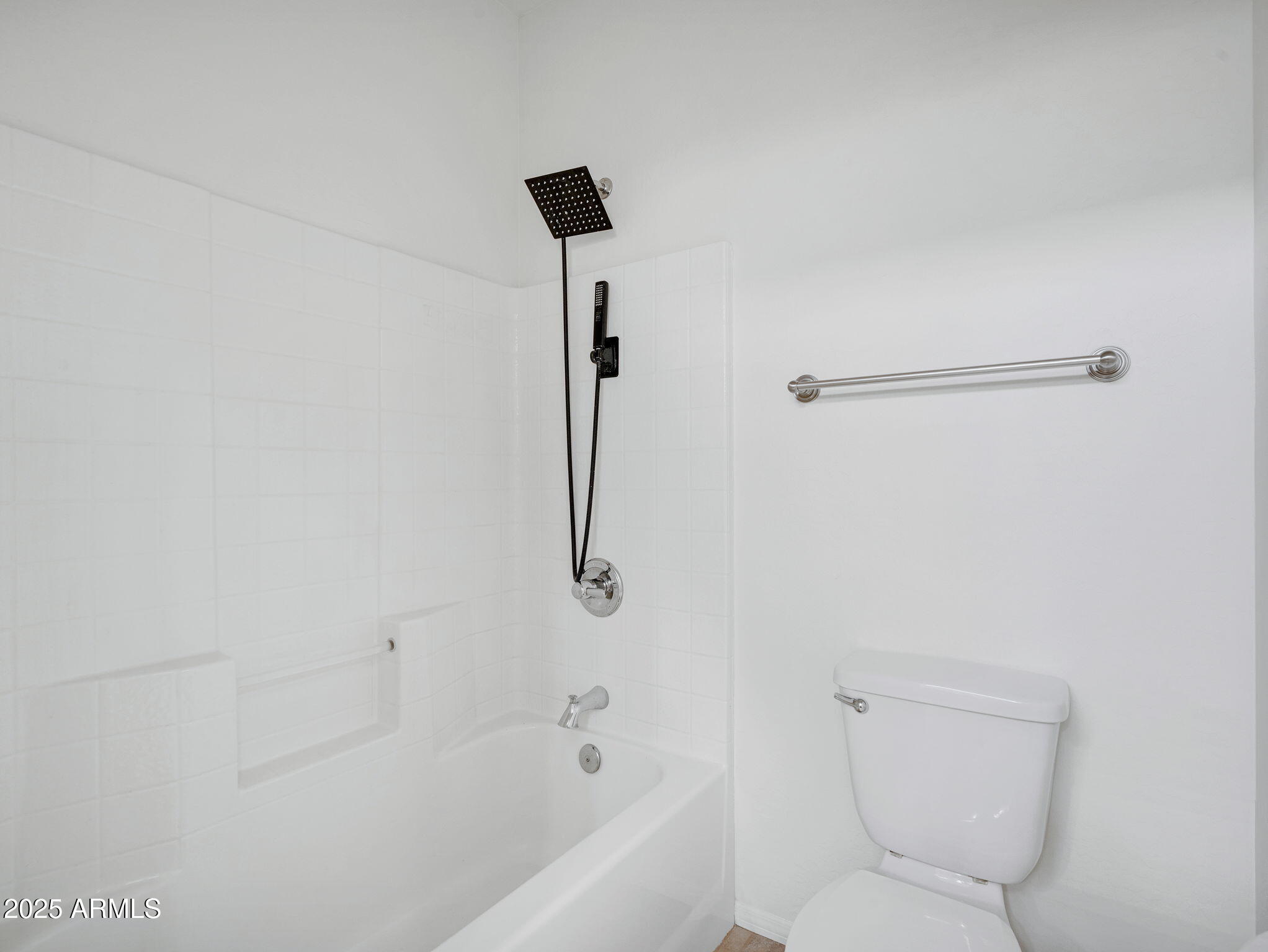 907 Quarter Horse Road Williams, AZ 86046 - Photo 19 of 26 a bathroom with a shower and a toilet