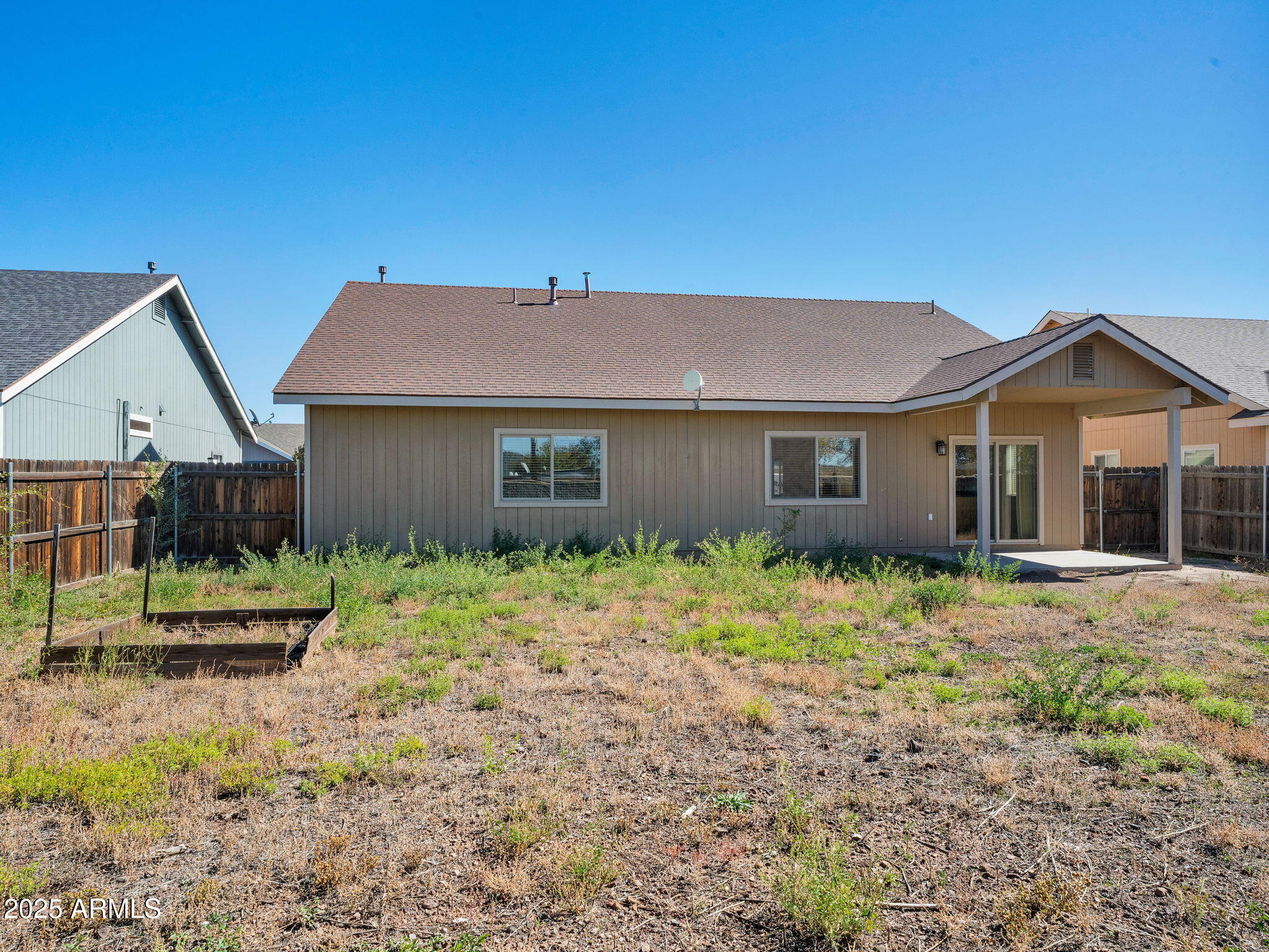 907 Quarter Horse Road Williams, AZ 86046 - Photo 25 of 26 a front view of a house with garden