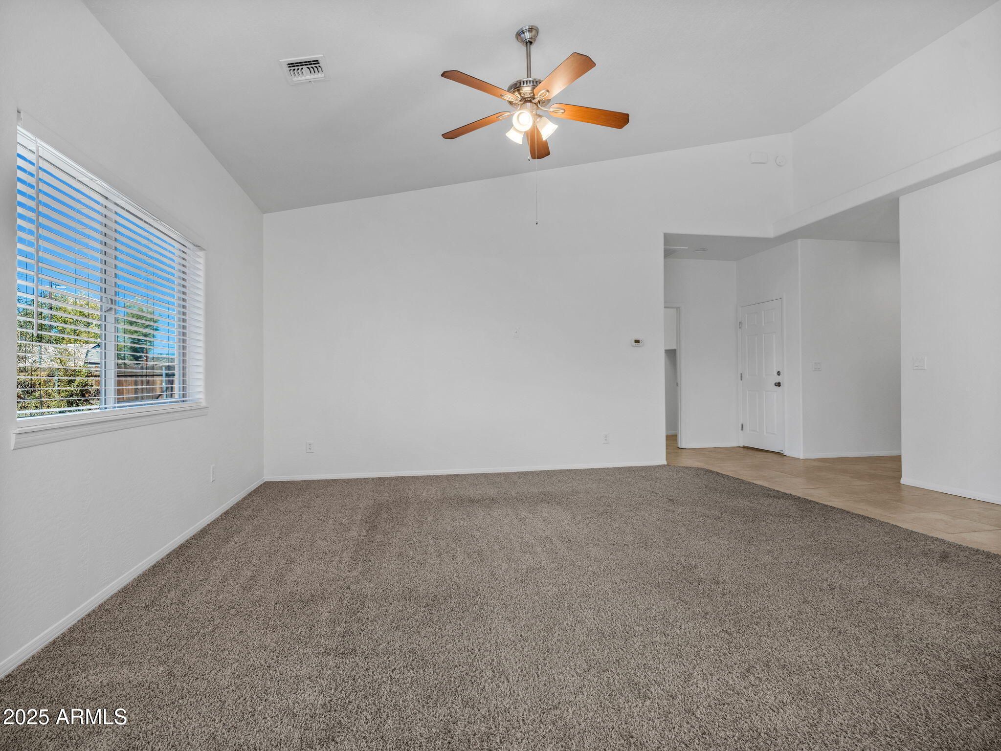 907 Quarter Horse Road Williams, AZ 86046 - Photo 6 of 26 a view of an empty room with a window