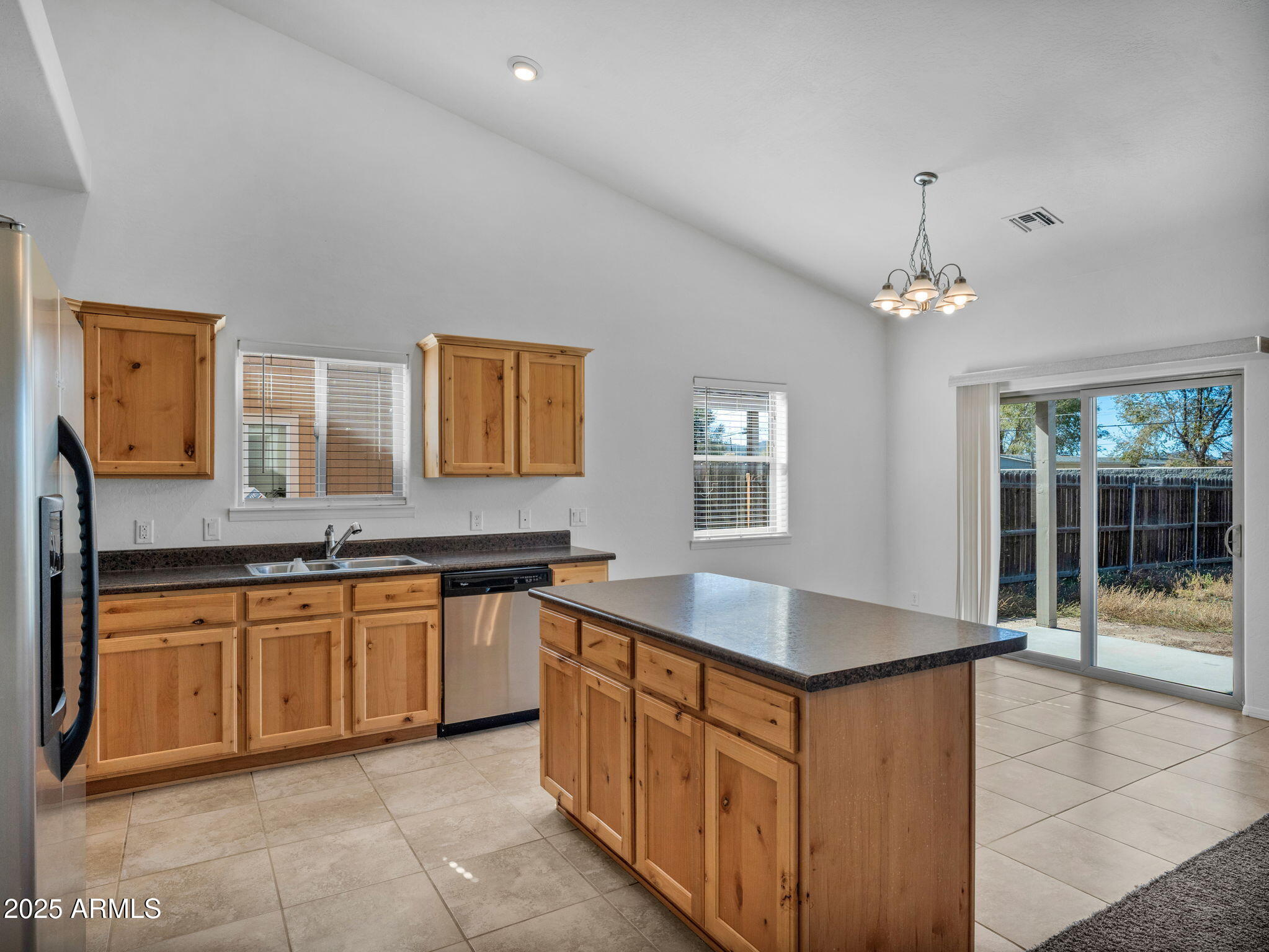 907 Quarter Horse Road Williams, AZ 86046 - Photo 10 of 26 a kitchen with granite countertop a sink and cabinets