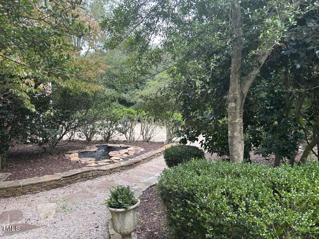 5109 Deer Forest Trail Raleigh, NC 27614 - Photo 5 of 35 05-Back walk, pond