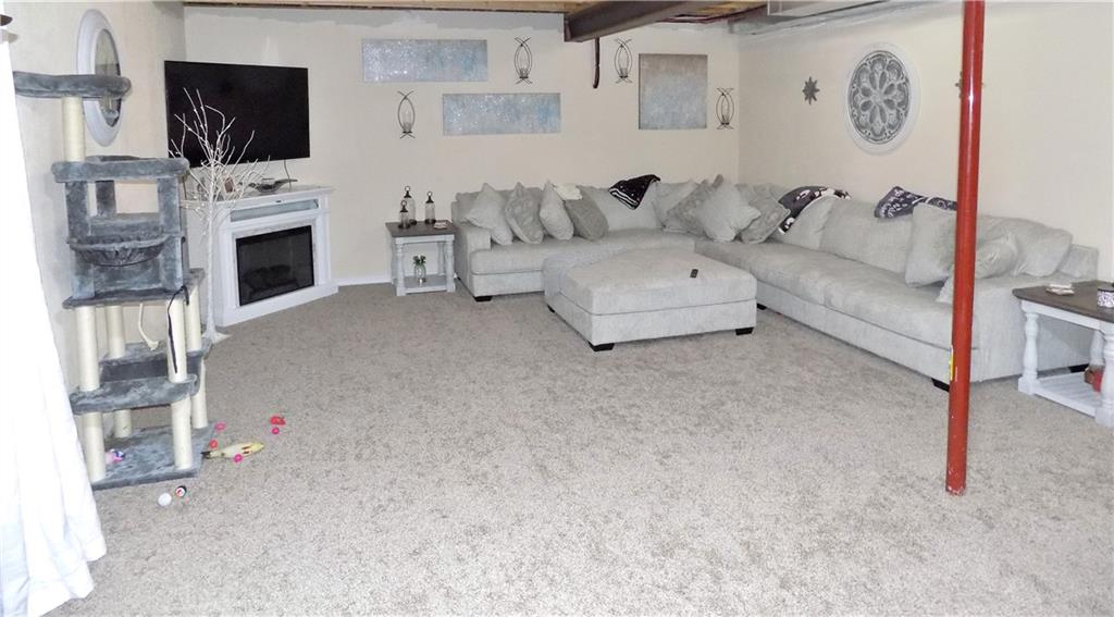 175 Springer Road McClellandtown, PA 15458 - Photo 12 of 18 a living room with furniture and a flat screen tv