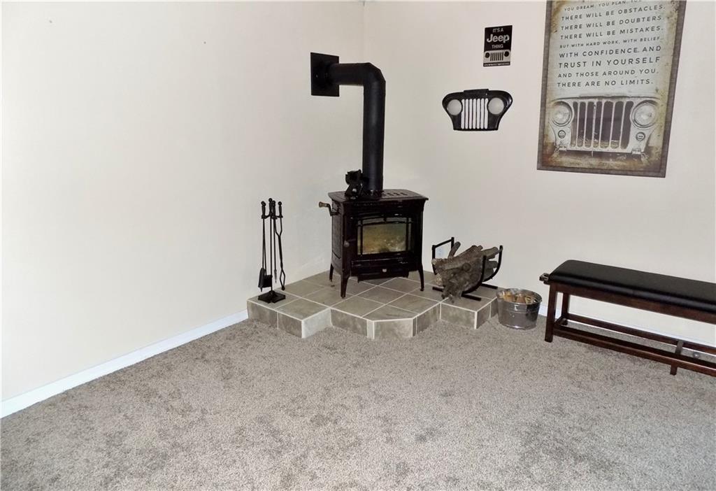 175 Springer Road McClellandtown, PA 15458 - Photo 13 of 18 a room with gym equipment and view of living room