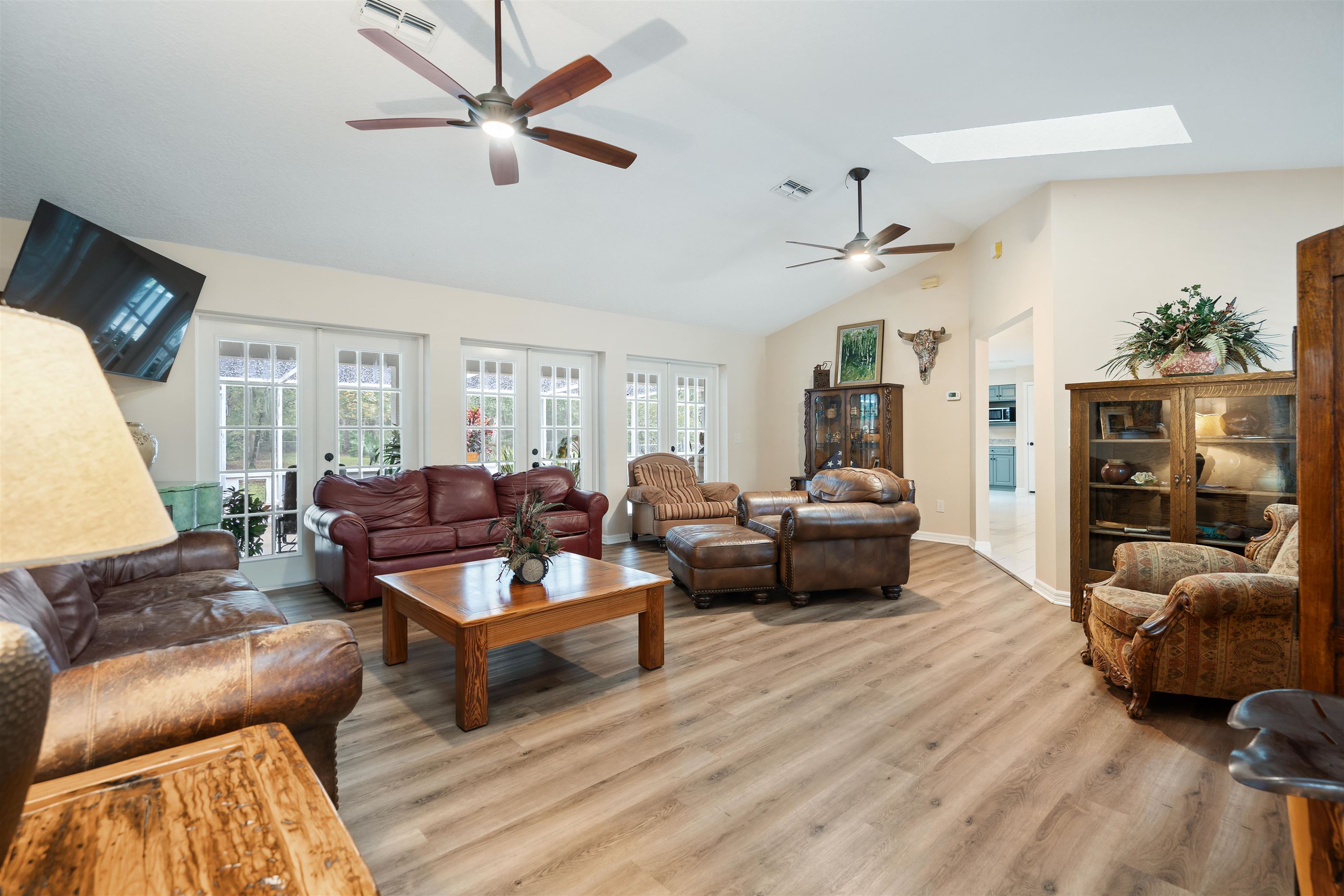 5525 St Ambrose Church Road Elkton, FL 32033 - Photo 14 of 66 a living room with furniture ceiling fan and a wooden floor