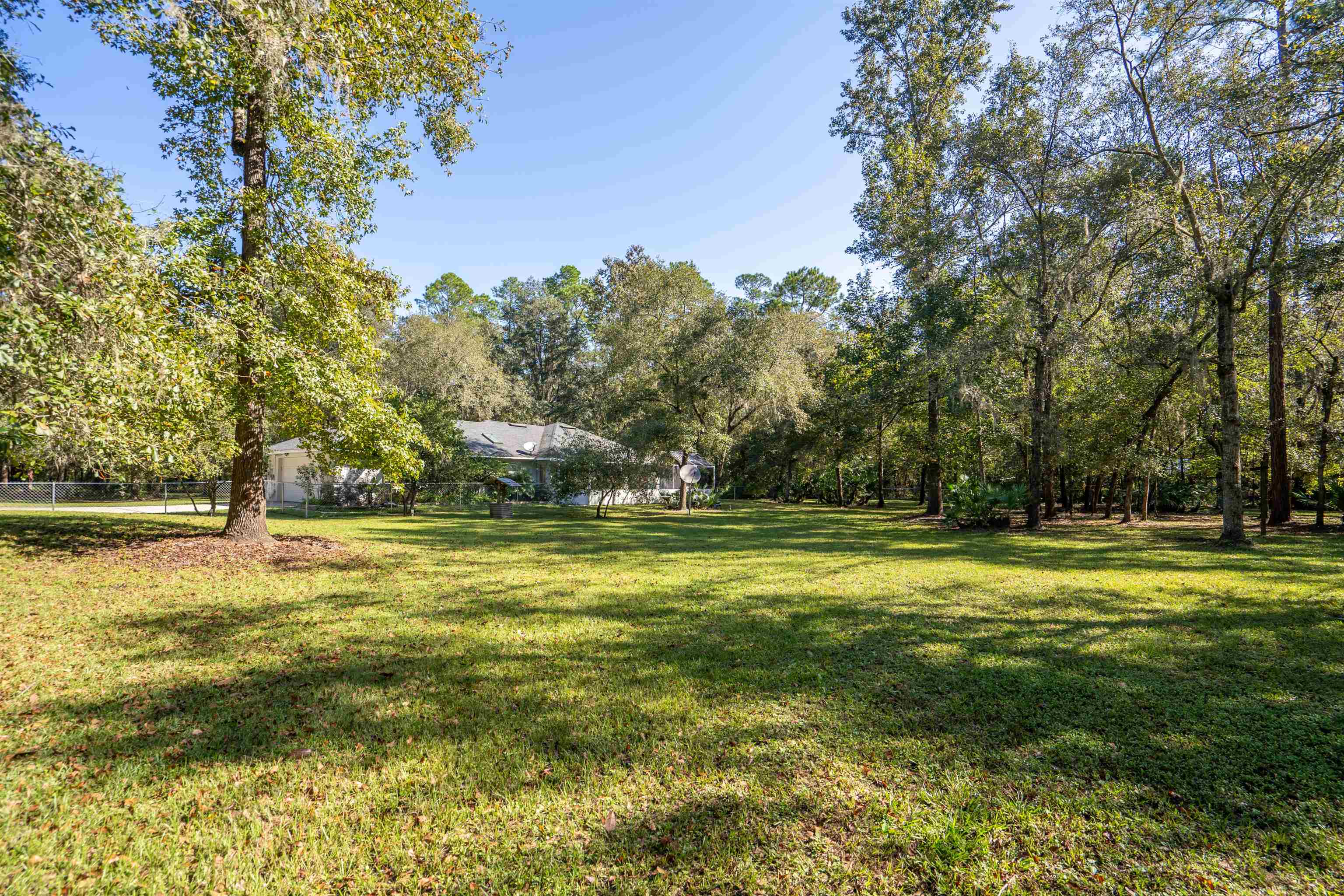 5525 St Ambrose Church Road Elkton, FL 32033 - Photo 33 of 66 a swimming pool with an outdoor space and seating area