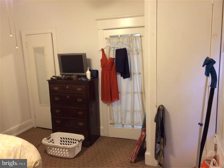 330 South Hicks Street Philadelphia, PA 19102 - Photo 13 of 21 a living room with furniture and a flat screen tv