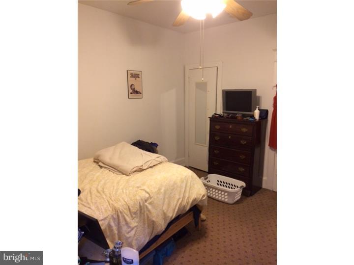 330 South Hicks Street Philadelphia, PA 19102 - Photo 14 of 21 a bedroom with a bed and a television