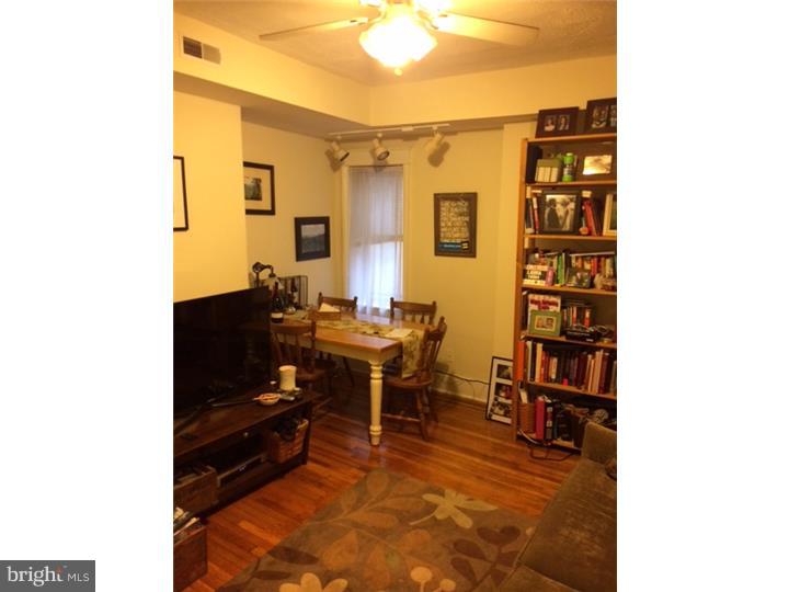 330 South Hicks Street Philadelphia, PA 19102 - Photo 15 of 21 a reading room with furniture a rug and a window