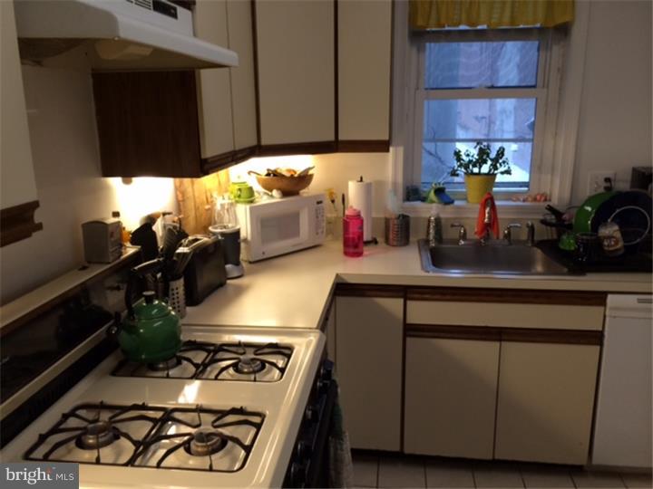 330 South Hicks Street Philadelphia, PA 19102 - Photo 17 of 21 a kitchen with a cabinets and window