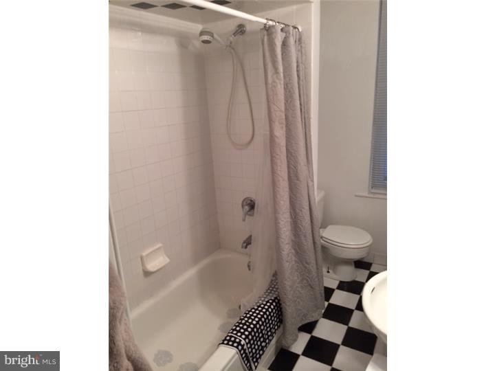 330 South Hicks Street Philadelphia, PA 19102 - Photo 18 of 21 a bathroom with a toilet a sink and a shower