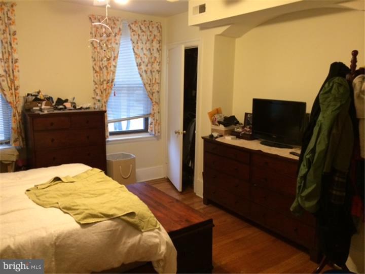 330 South Hicks Street Philadelphia, PA 19102 - Photo 19 of 21 a bedroom with a bed and flat screen tv