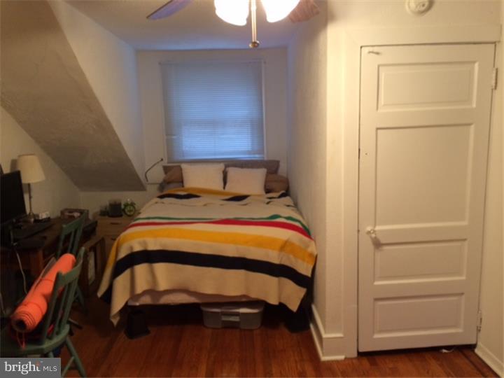 330 South Hicks Street Philadelphia, PA 19102 - Photo 20 of 21 a bedroom with a bed and a window
