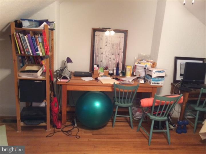 330 South Hicks Street Philadelphia, PA 19102 - Photo 21 of 21 a room with furniture a flat screen tv and a fireplace