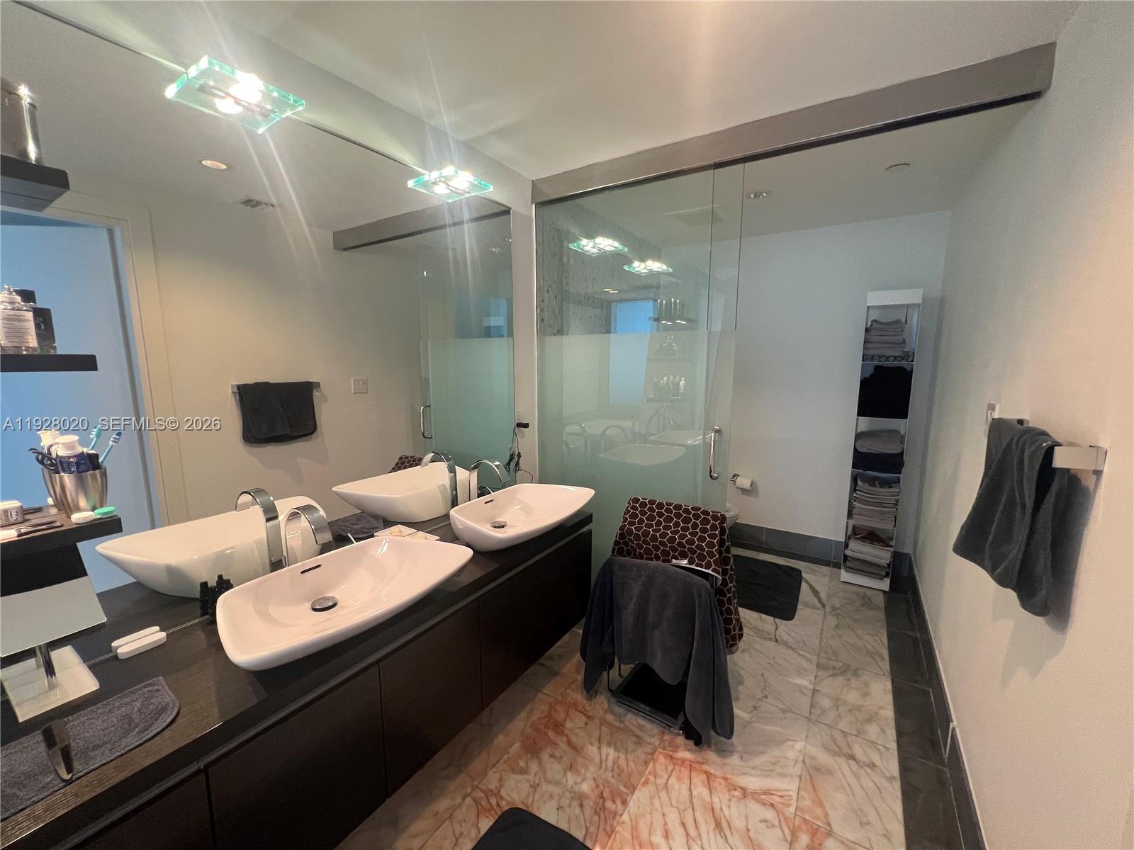 200 Biscayne Blvd Way, Unit 3106 Miami, FL 33131 - Photo 15 of 27 a view of a workspace with furniture