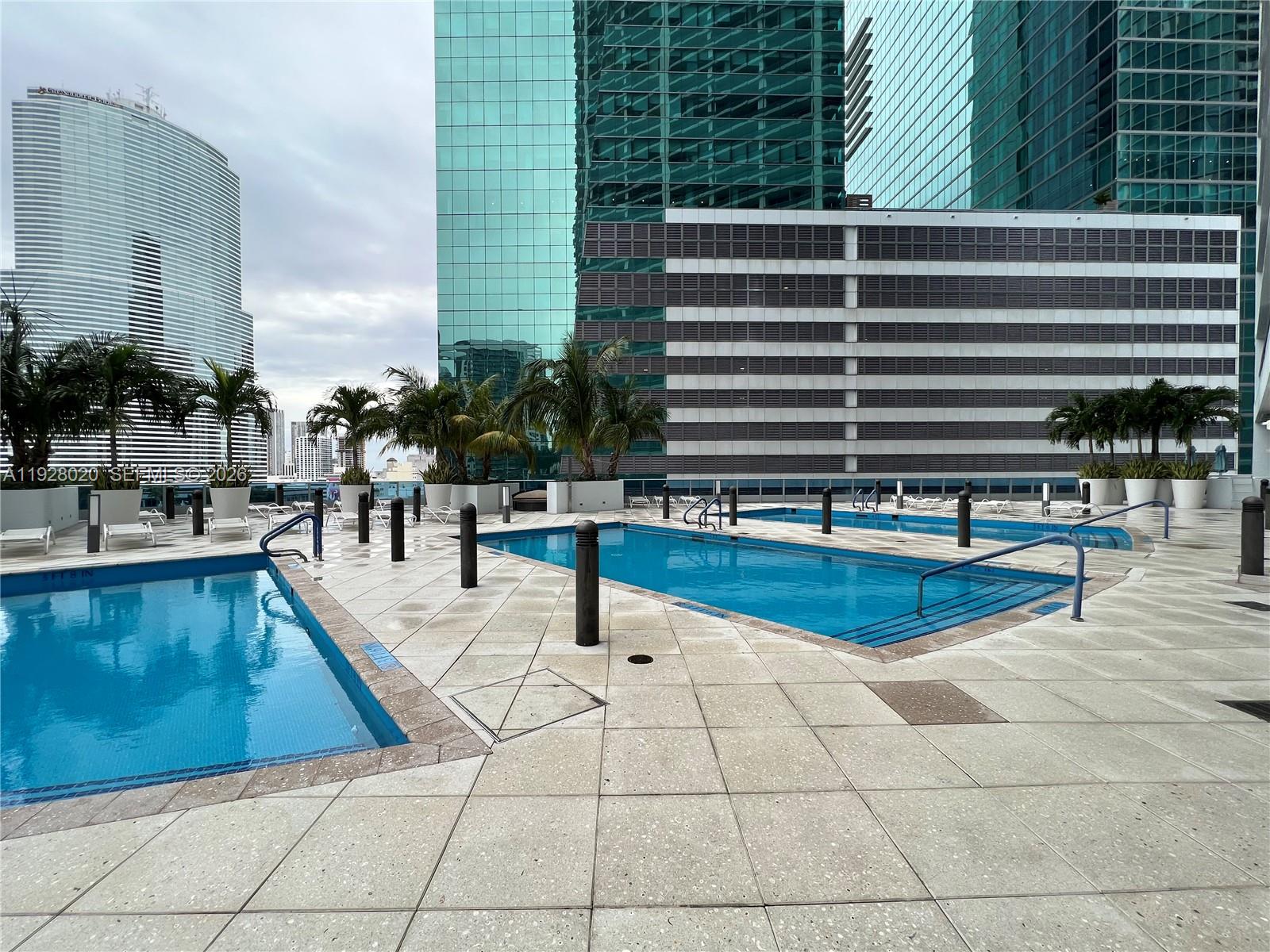 200 Biscayne Blvd Way, Unit 3106 Miami, FL 33131 - Photo 27 of 27 a swimming pool with outdoor seating