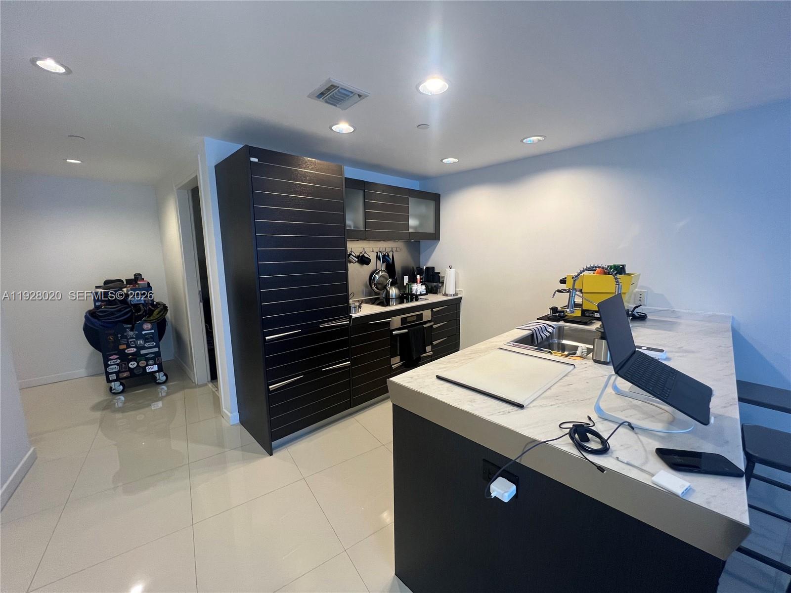 200 Biscayne Blvd Way, Unit 3106 Miami, FL 33131 - Photo 10 of 27 a room with storage and utility