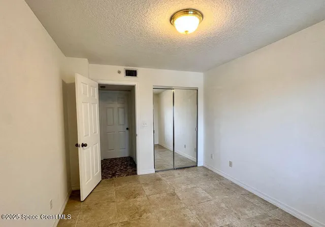 a bathroom with a sink and mirror with toilet