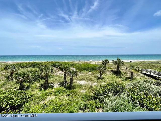 a bathroom with a tub a sink and mirror