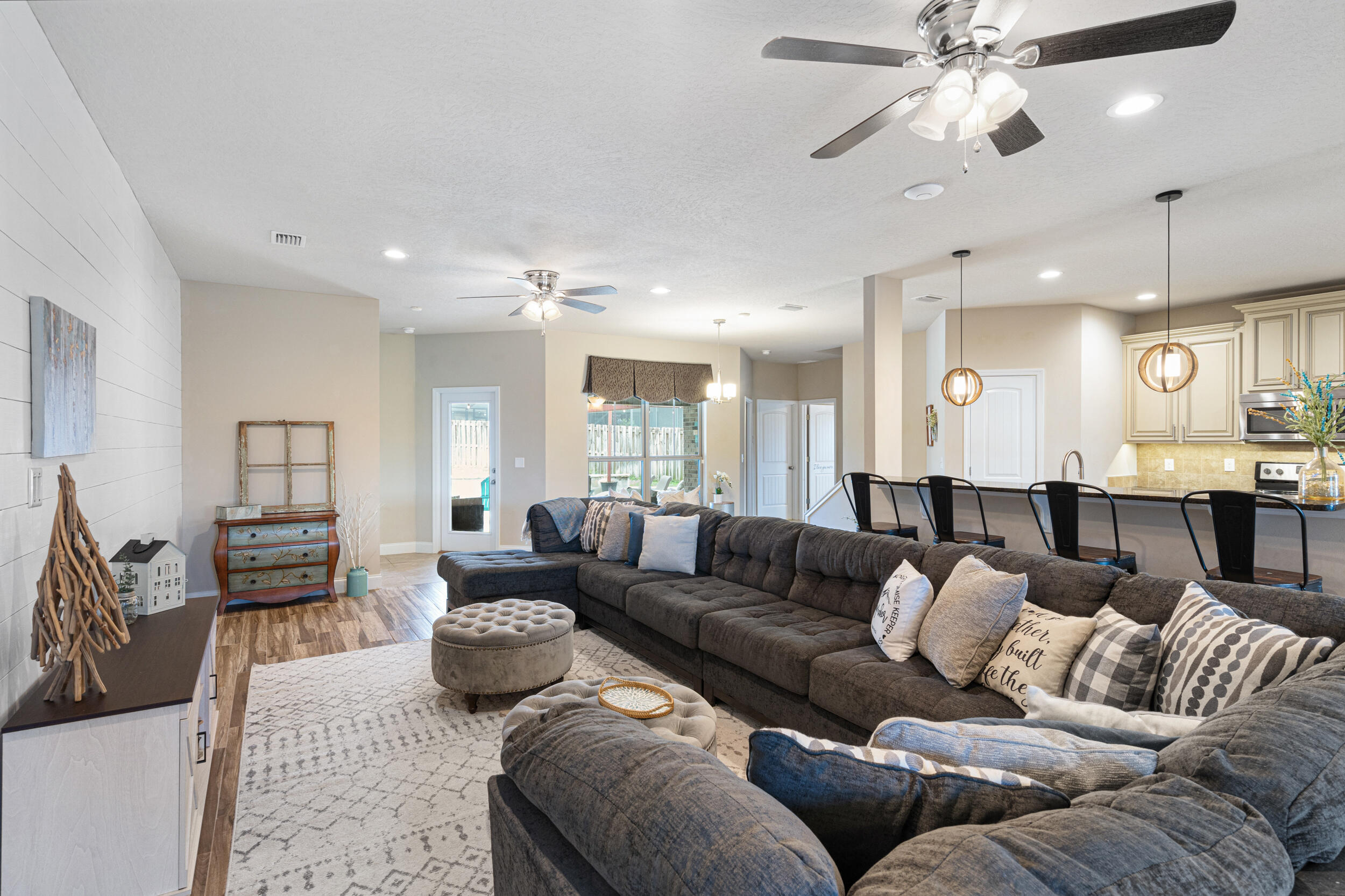 4646 Chanan Drive Crestview, FL 32539 - Photo 14 of 56 a living room with furniture kitchen view and a chandelier
