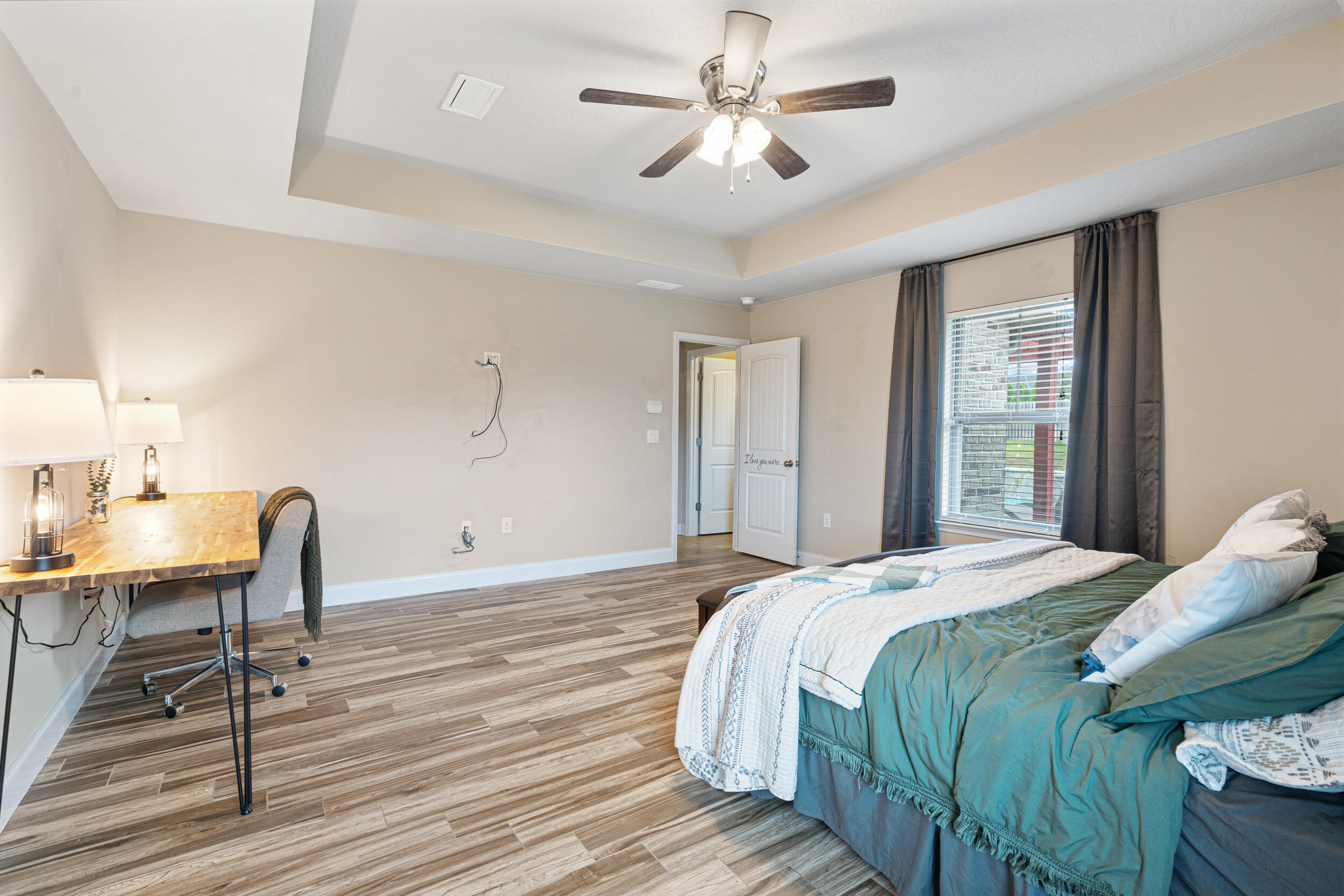 4646 Chanan Drive Crestview, FL 32539 - Photo 18 of 56 a bedroom with a bed a table and chair