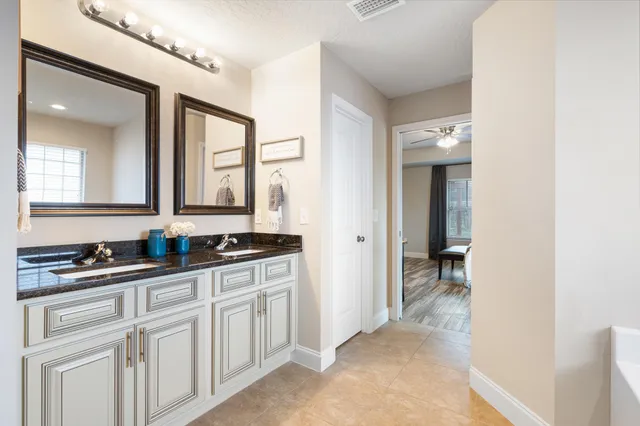 a white bath tub sitting next to a window