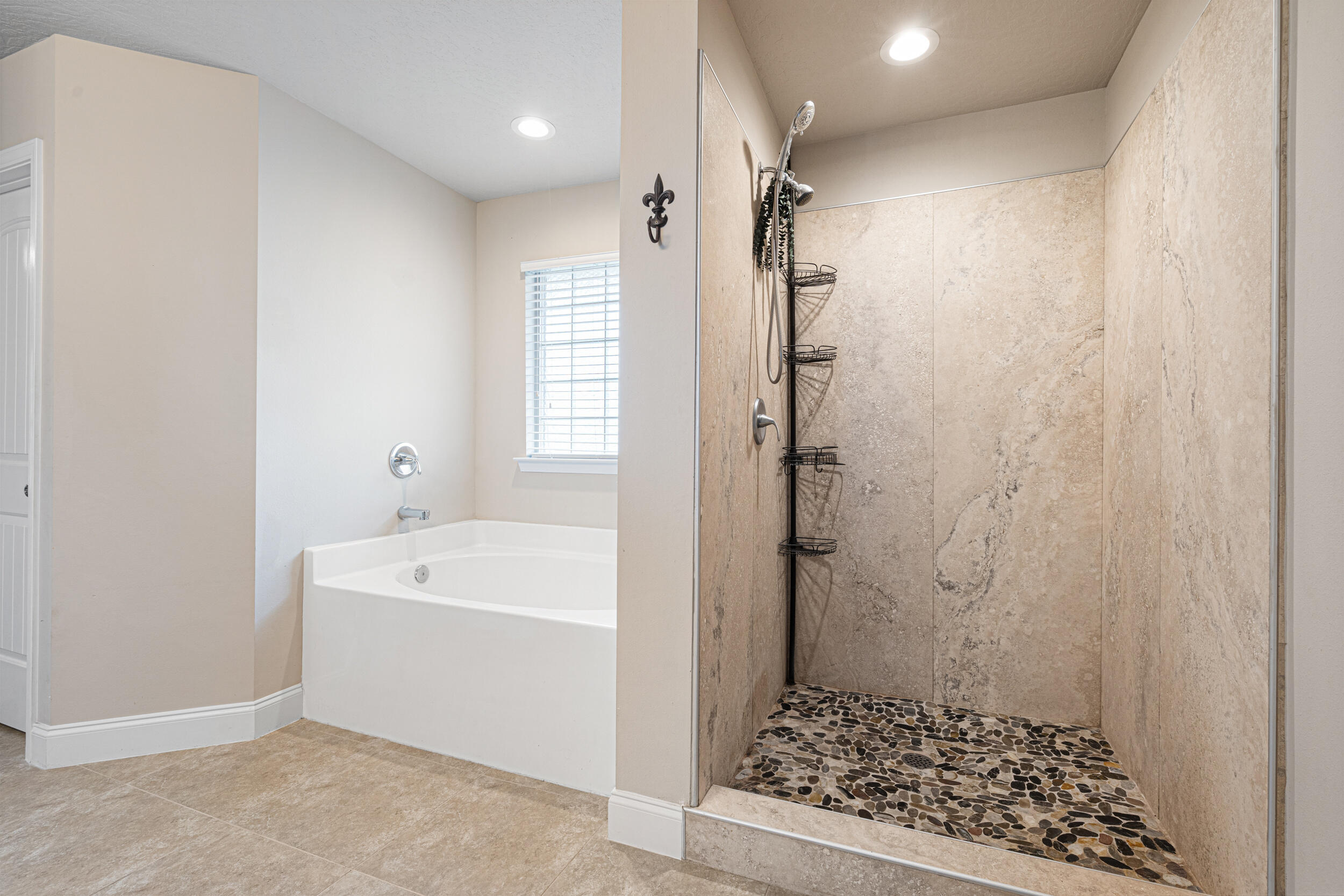4646 Chanan Drive Crestview, FL 32539 - Photo 20 of 56 a bathroom with a bathtub a shower a toilet and a sink