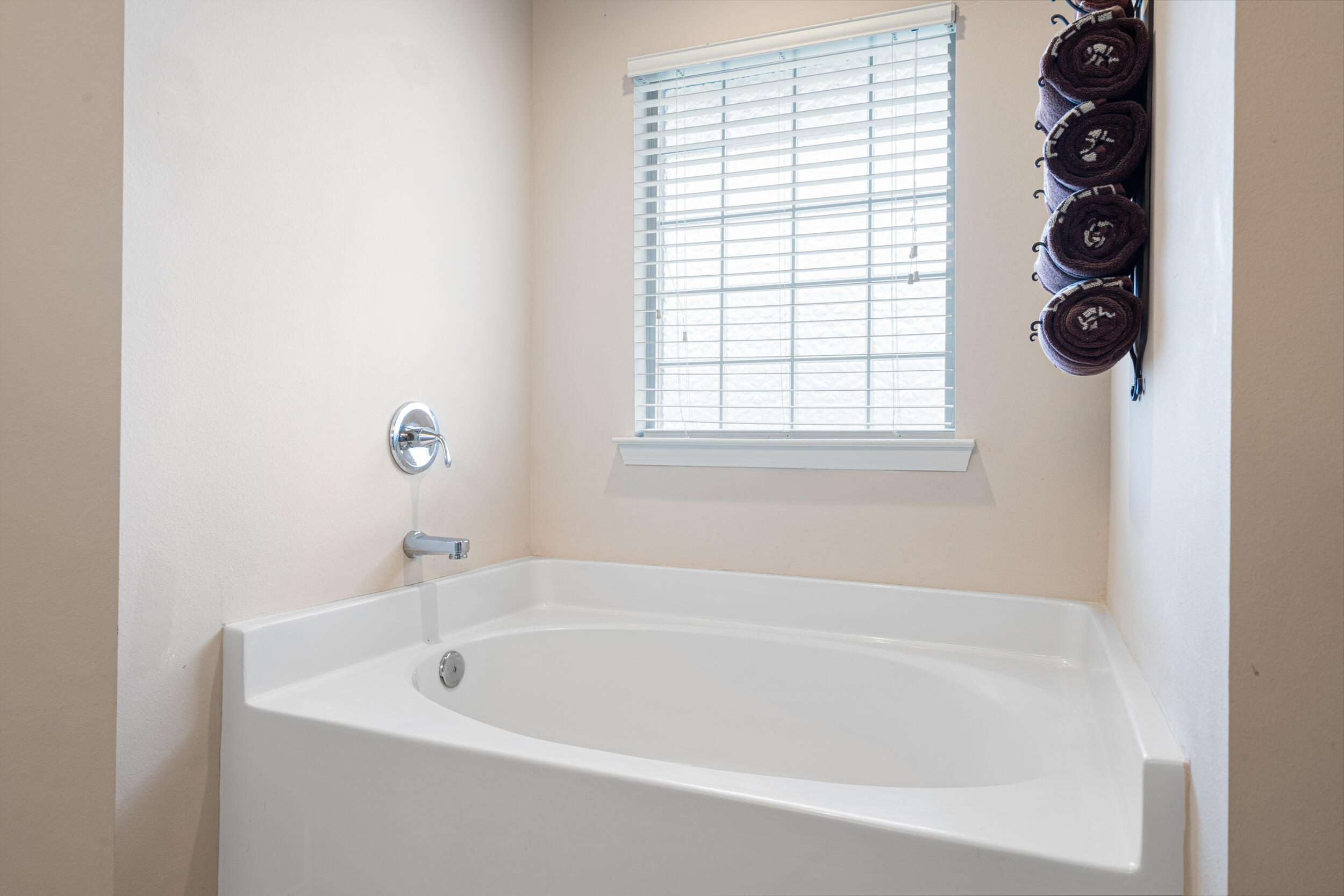 4646 Chanan Drive Crestview, FL 32539 - Photo 21 of 56 a white bath tub sitting next to a window