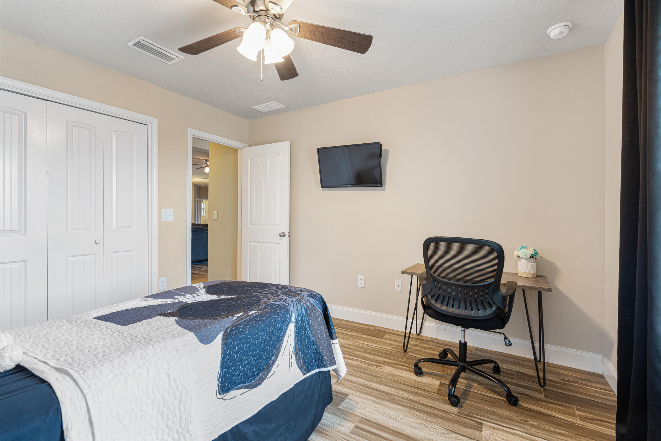 4646 Chanan Drive Crestview, FL 32539 - Photo 24 of 56 a bedroom with a bed and a chair