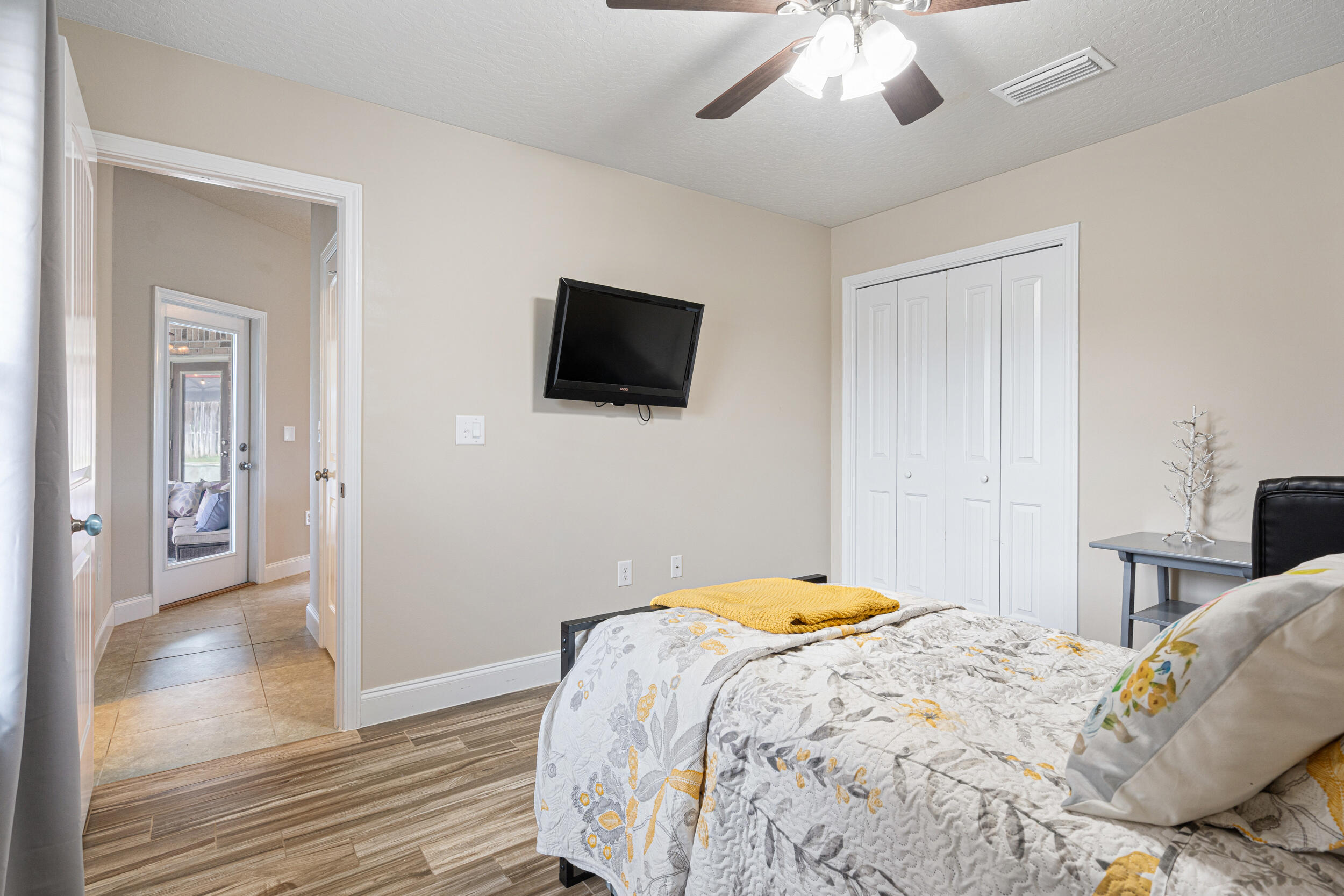 4646 Chanan Drive Crestview, FL 32539 - Photo 30 of 56 a bedroom with a bed and a flat screen tv