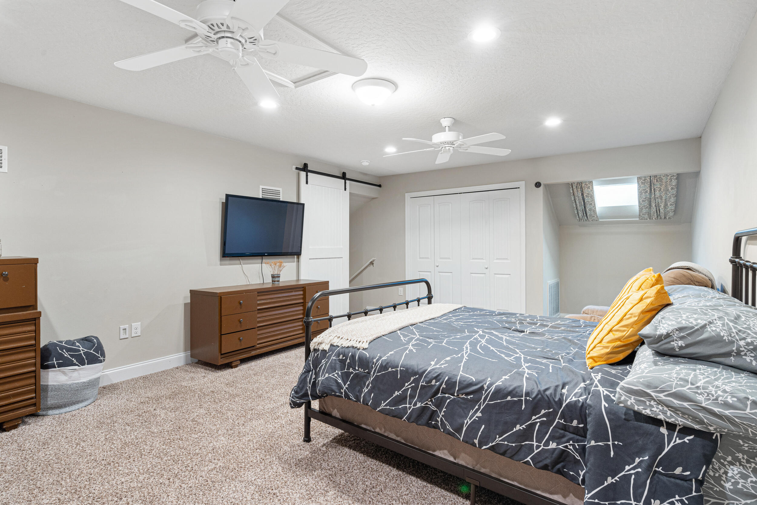 4646 Chanan Drive Crestview, FL 32539 - Photo 35 of 56 a bedroom with a bed and a flat screen tv