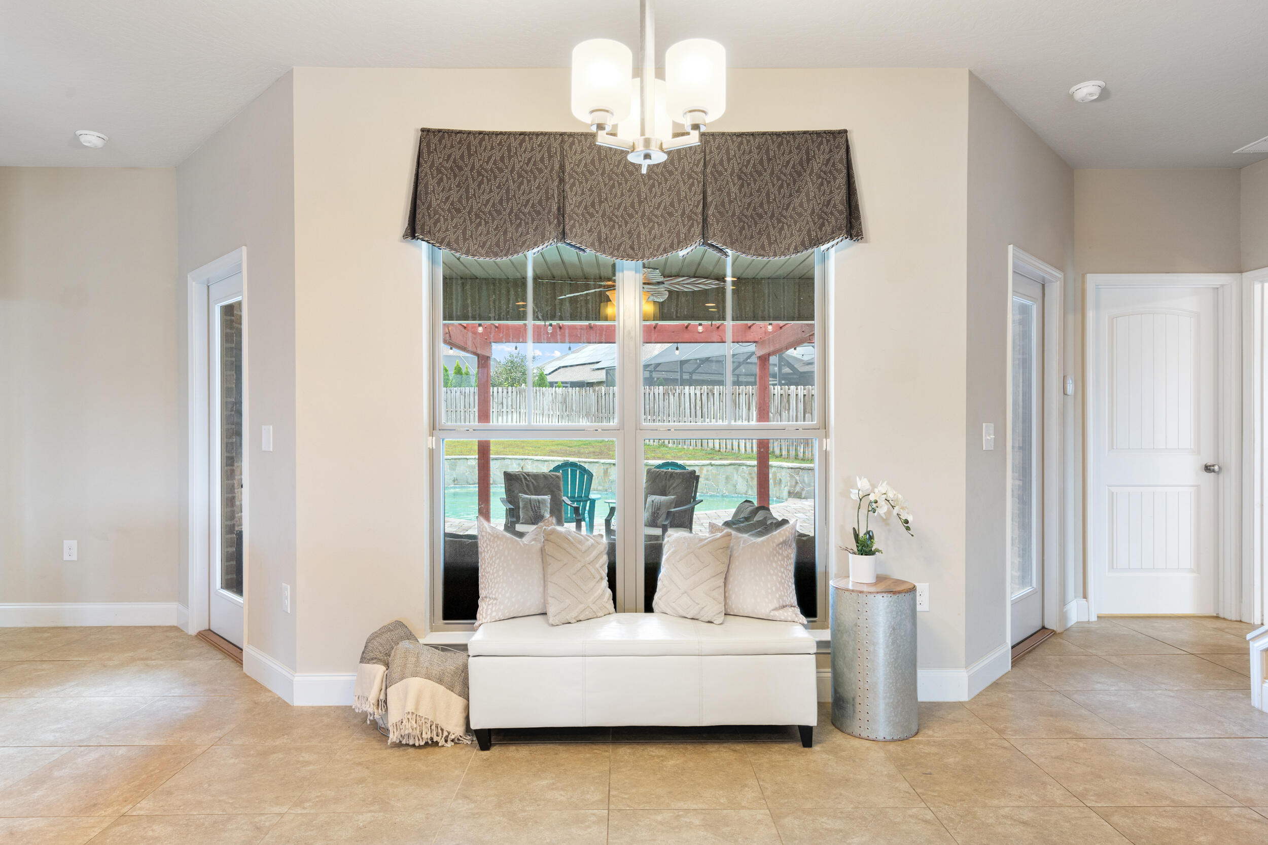 4646 Chanan Drive Crestview, FL 32539 - Photo 37 of 56 a living room with furniture and a chandelier