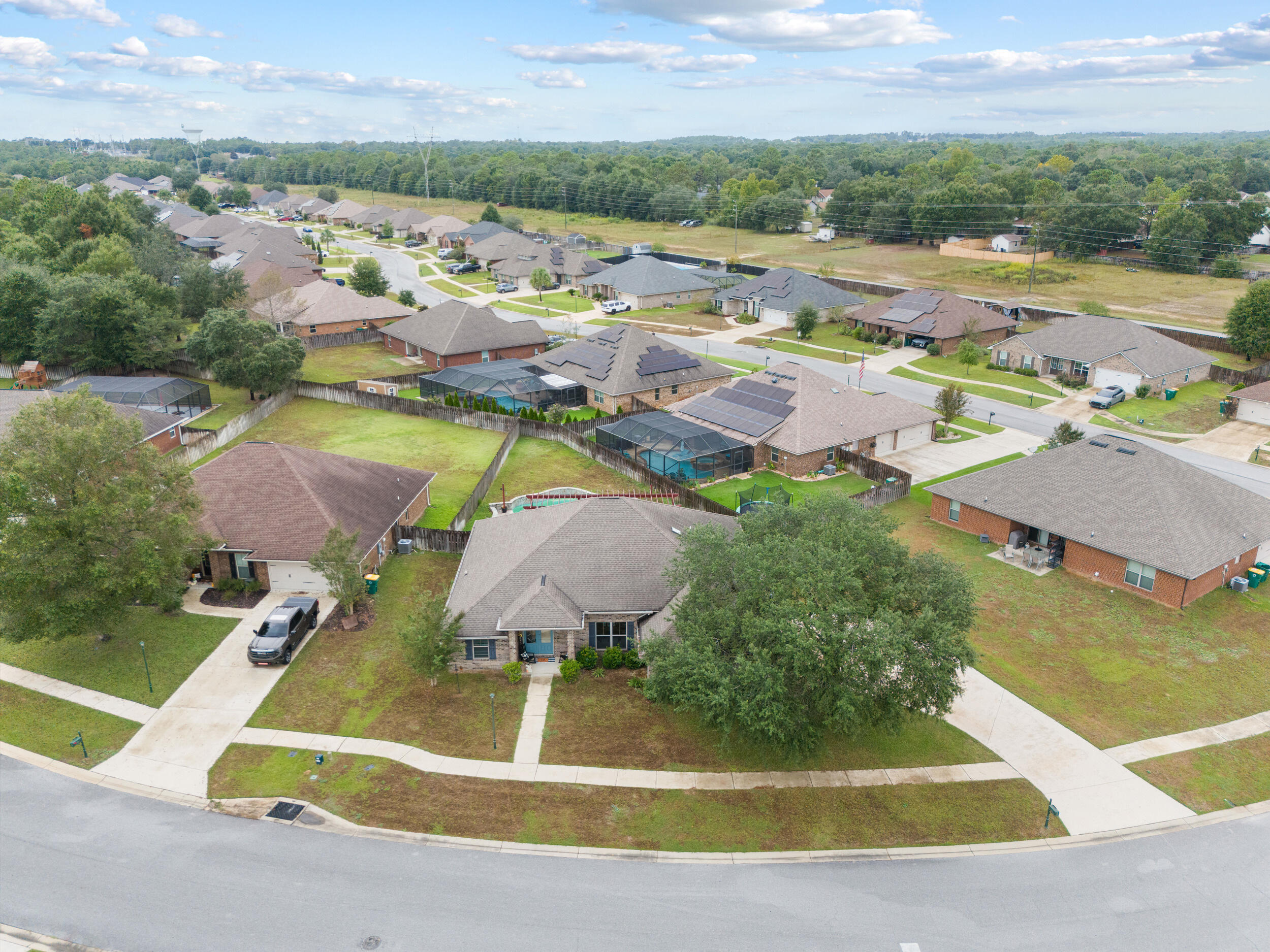 4646 Chanan Drive Crestview, FL 32539 - Photo 51 of 56 an aerial view of residential houses with outdoor space