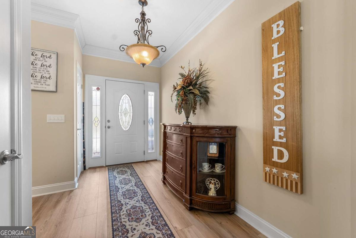 105 Plantation Pnes Drive Blackshear, GA 31516 - Photo 19 of 48 a view of gallery with wooden floor