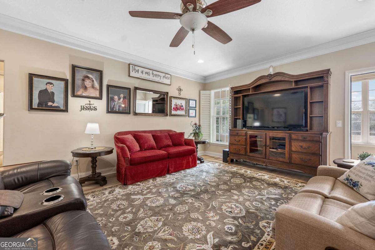 105 Plantation Pnes Drive Blackshear, GA 31516 - Photo 20 of 48 a living room with furniture and a flat screen tv