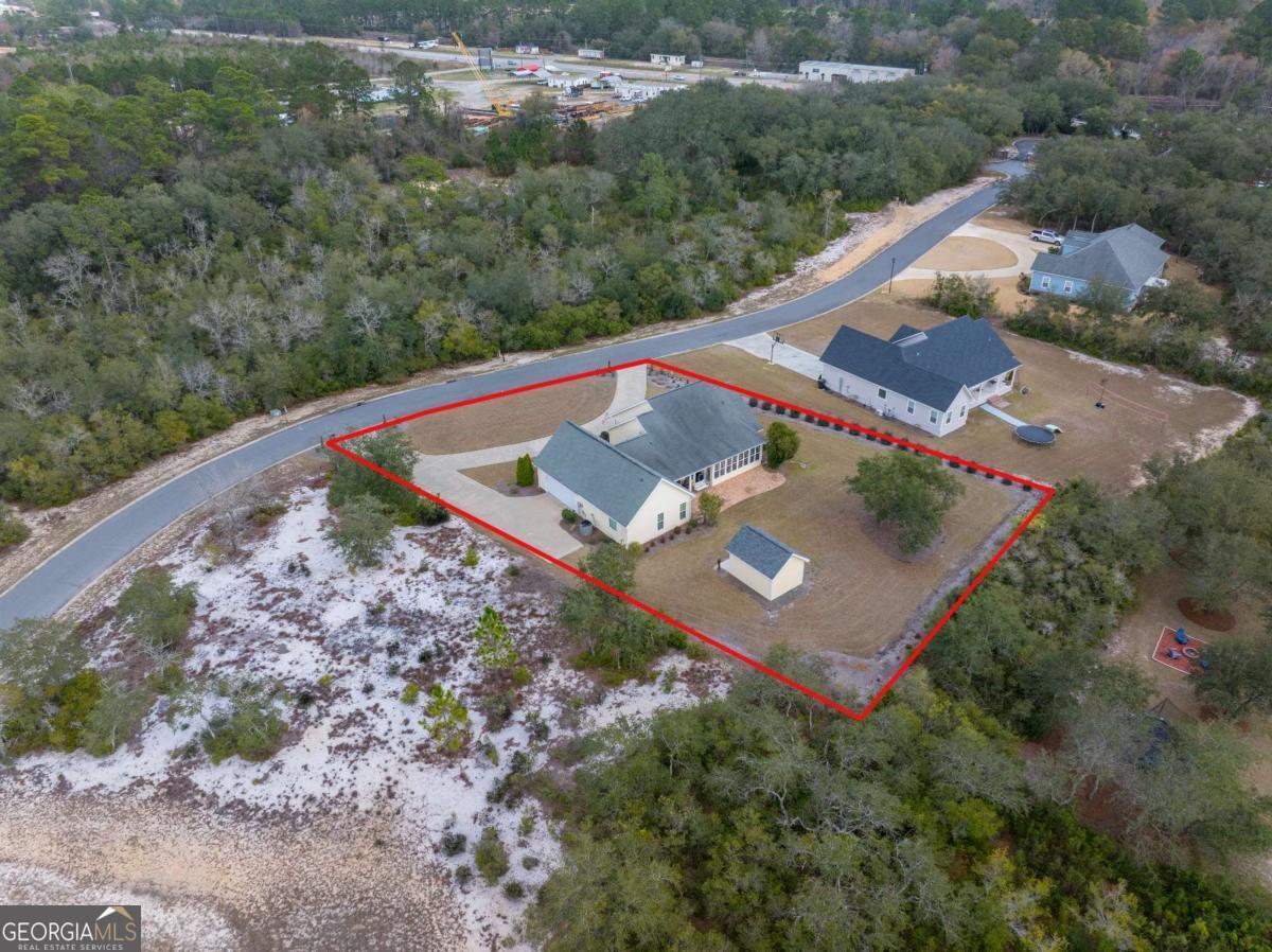 105 Plantation Pnes Drive Blackshear, GA 31516 - Photo 2 of 48 an aerial view of a house with a yard