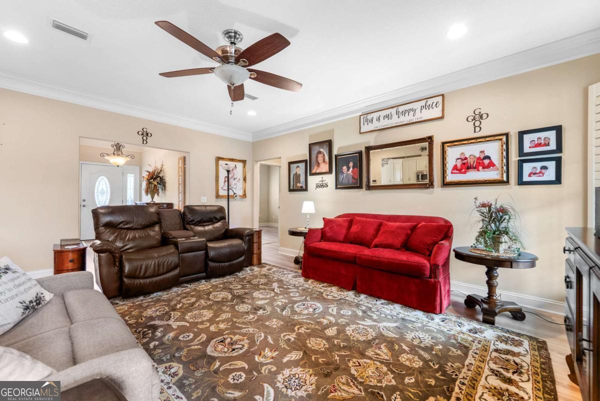 105 Plantation Pnes Drive Blackshear, GA 31516 - Photo 21 of 48 a living room with furniture and a rug