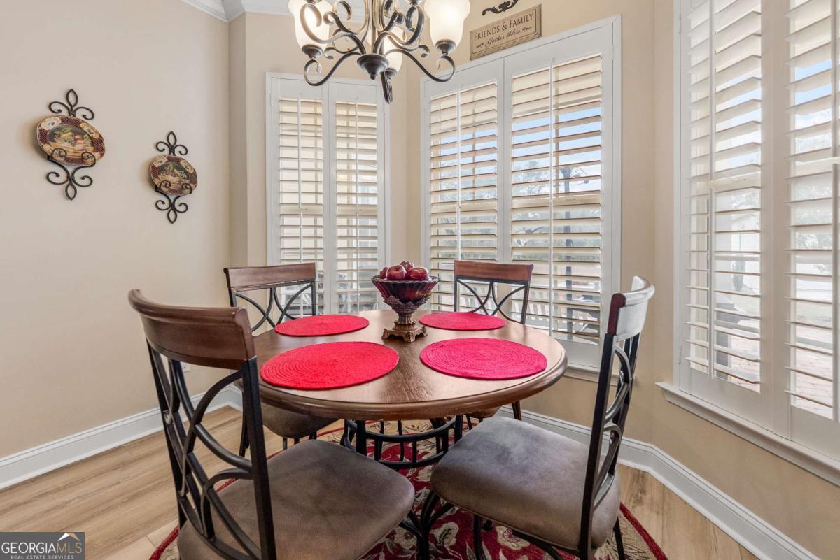 105 Plantation Pnes Drive Blackshear, GA 31516 - Photo 28 of 48 a view of a dining room with furniture and window