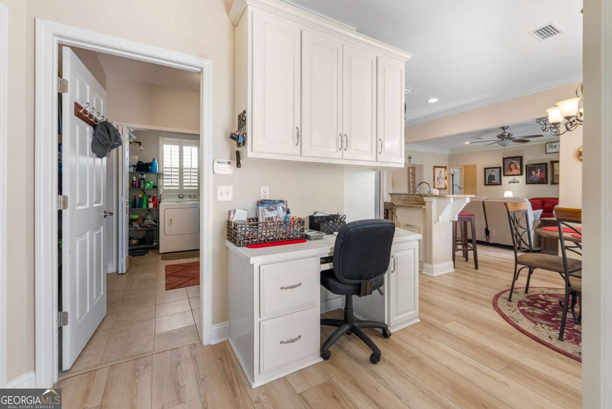 105 Plantation Pnes Drive Blackshear, GA 31516 - Photo 30 of 48 a view of a kitchen with workspace and a window
