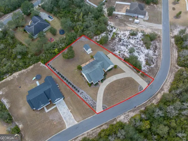 an aerial view of residential house with outdoor space
