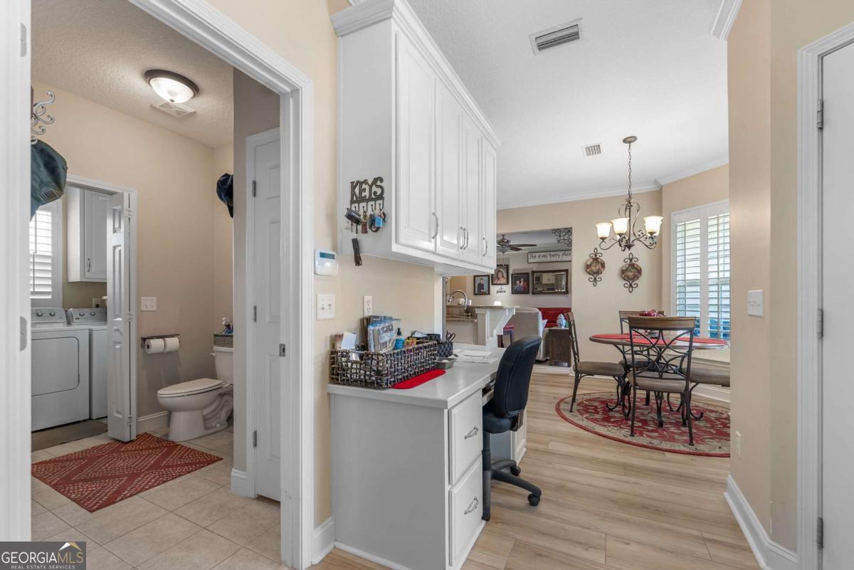 105 Plantation Pnes Drive Blackshear, GA 31516 - Photo 31 of 48 a workspace with furniture and wooden floor
