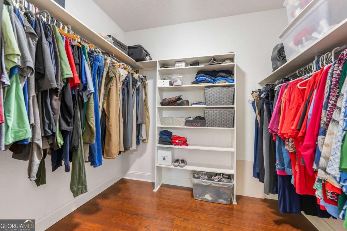 105 Plantation Pnes Drive Blackshear, GA 31516 - Photo 40 of 48 a view of walk in closet with clothes and shoes