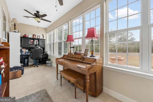 a view of a livingroom with furniture and window