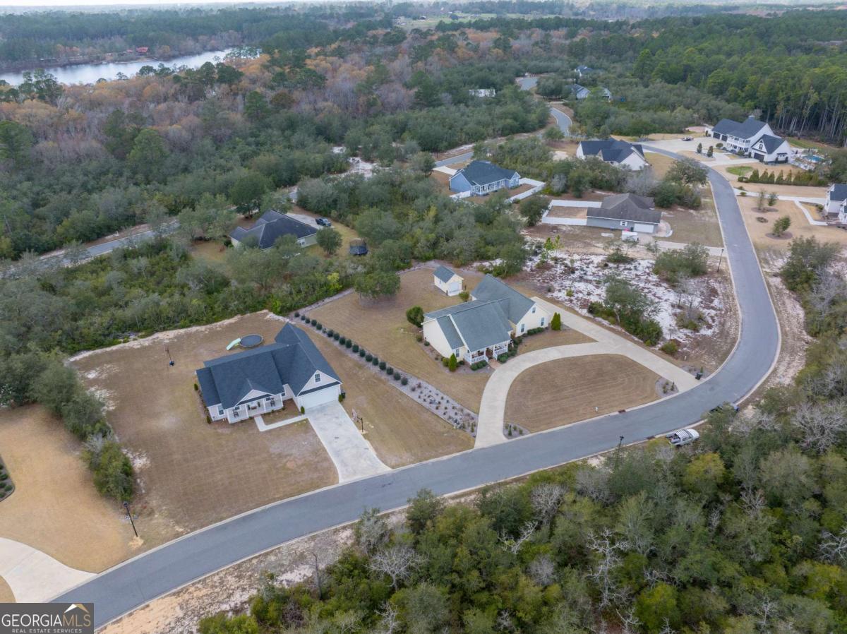 105 Plantation Pnes Drive Blackshear, GA 31516 - Photo 5 of 48 an aerial view of residential houses with outdoor space