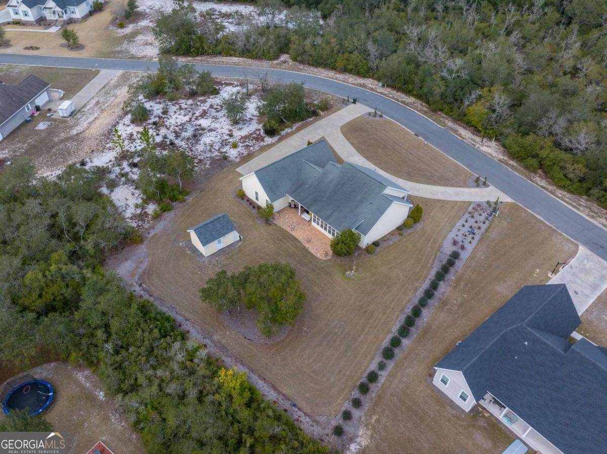 105 Plantation Pnes Drive Blackshear, GA 31516 - Photo 7 of 48 an aerial view of a house with a yard