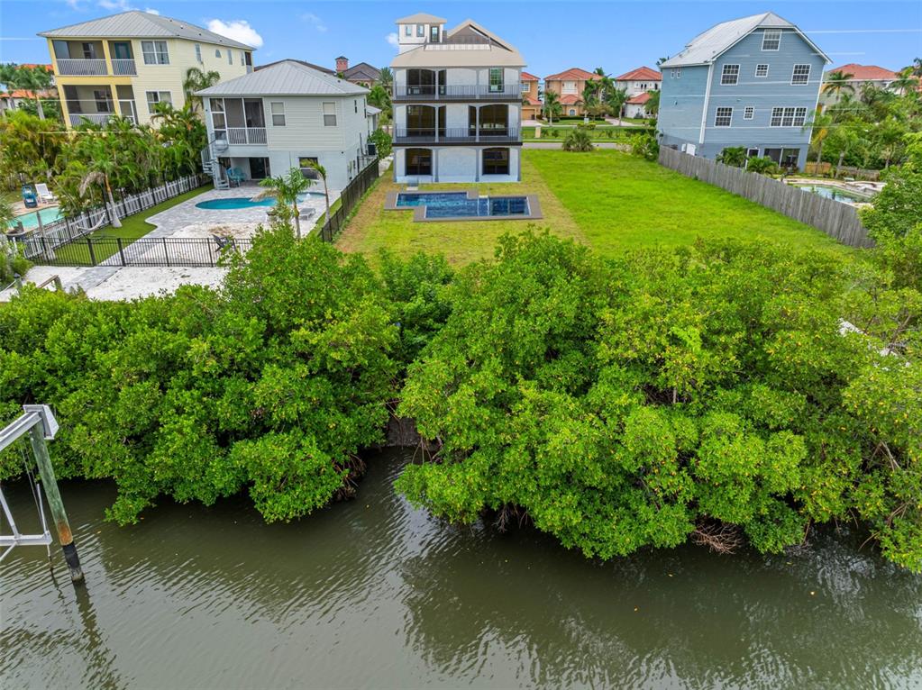 6415 Marbella Boulevard Apollo Beach, FL 33572 - Photo 5 of 14 an aerial view of a house with swimming pool patio and lake view