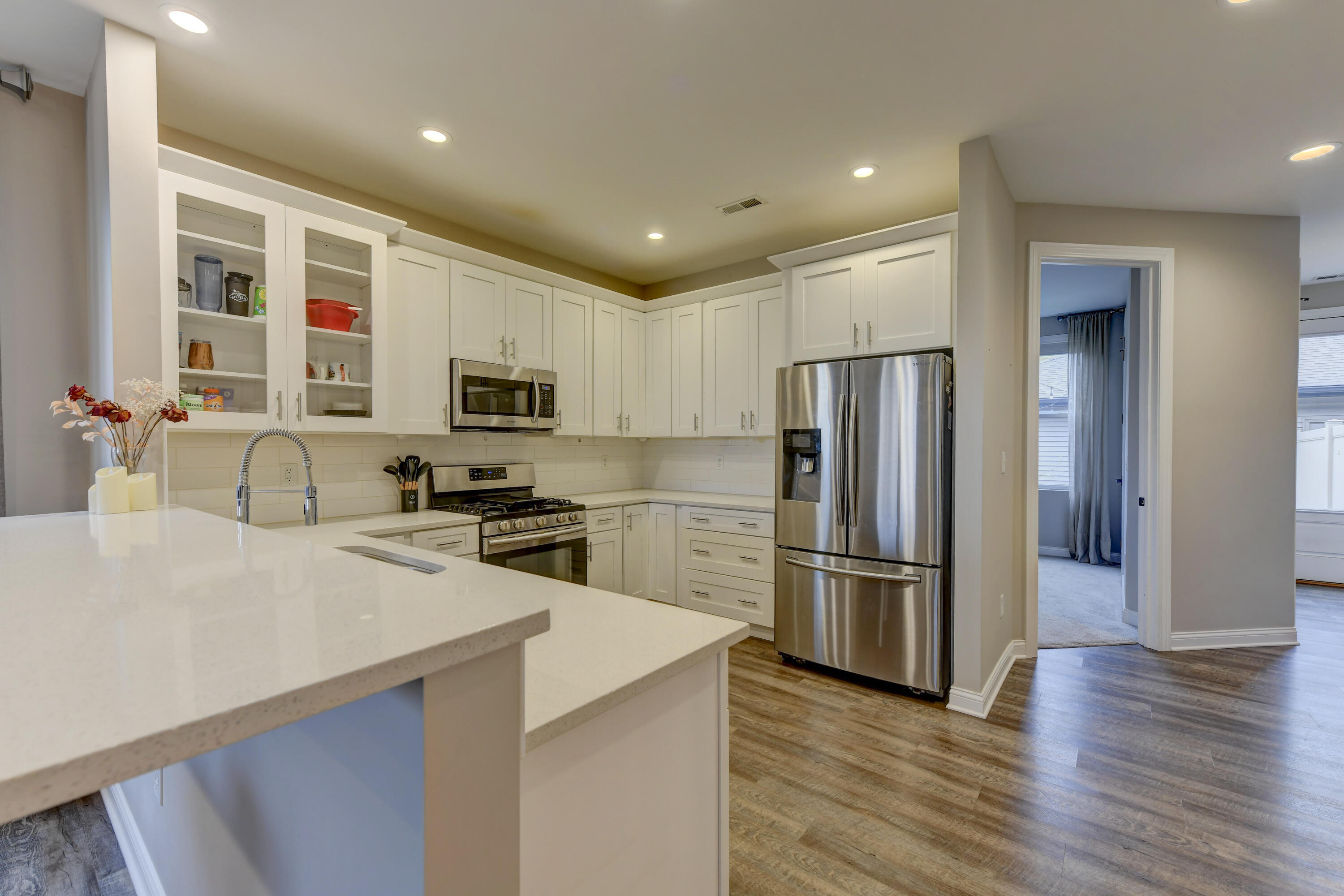 360 North Indiana Avenue Crown Point, IN 46307 - Photo 3 of 22 a kitchen with stainless steel appliances granite countertop a refrigerator microwave and stove